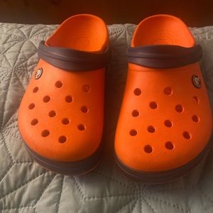Orange Crocs w/Navy Blue strap.